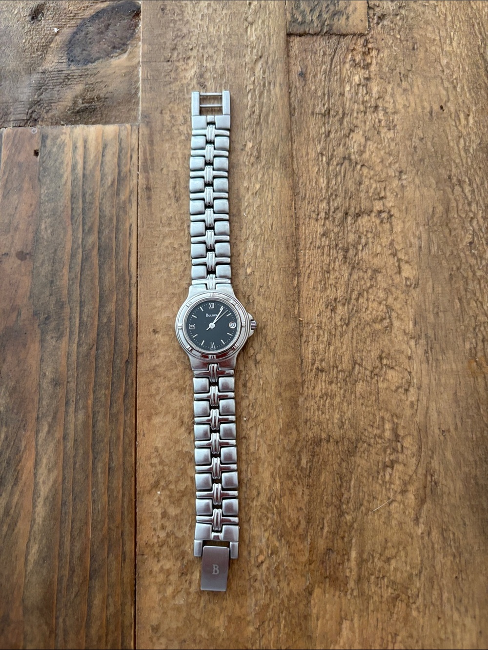 Vintage Women’s Stainless Steel Bulova Quartz Watch with Black Dial